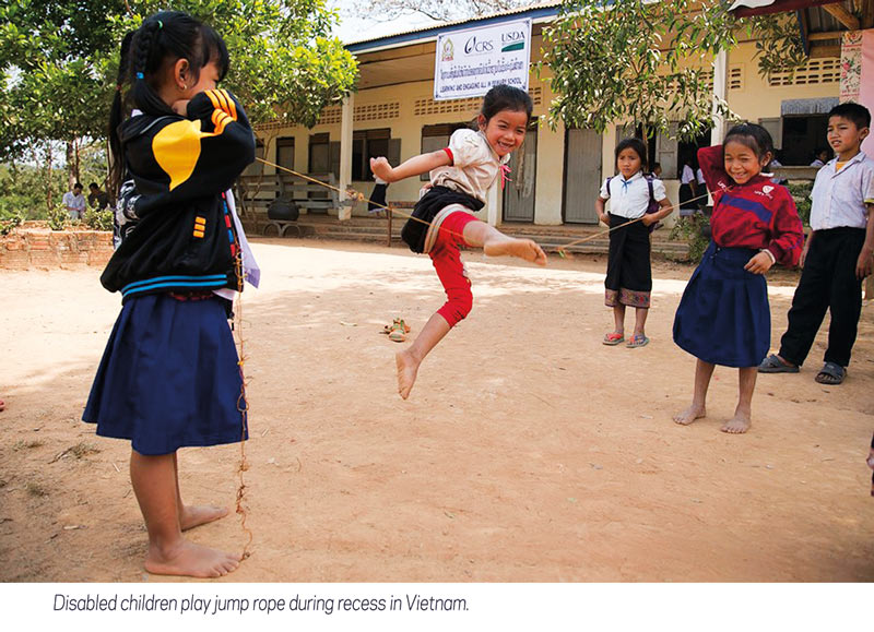 disabled children play jump rope in Vietnam