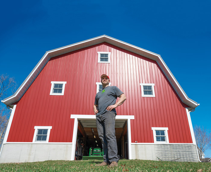 Brad Badertscher with a red barn in the background