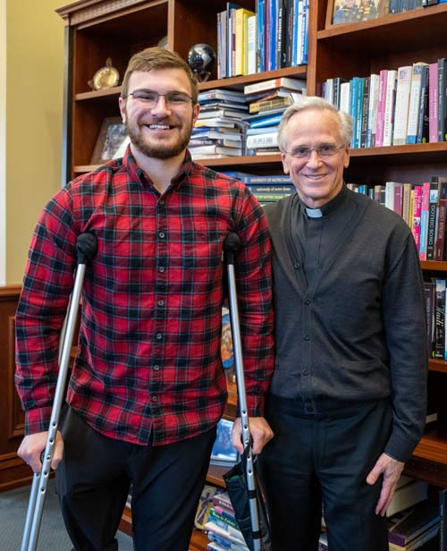 Andrew Daigneau with Fr. Jenkins