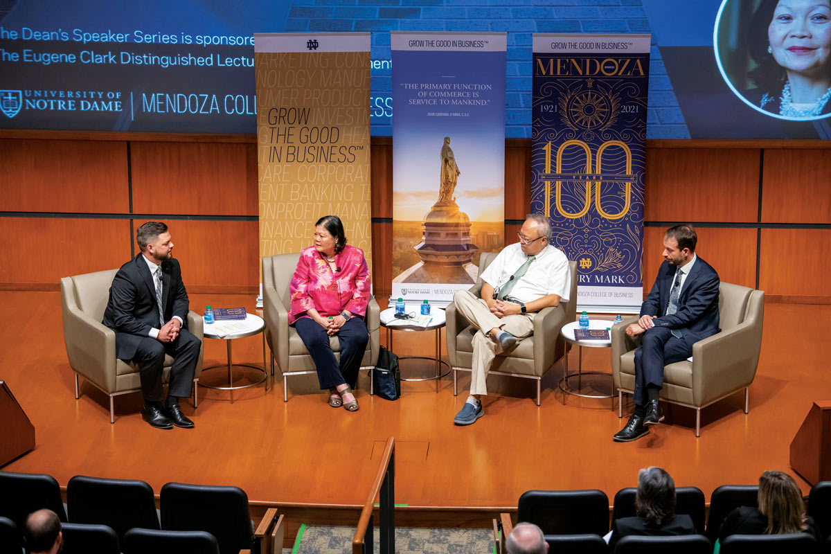 Two former and the current dean of Mendoza College sit on a panel in Jordan Auditorium