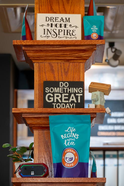 A wall display of tea and inspirational signs in Tamika Catchings' tea shop