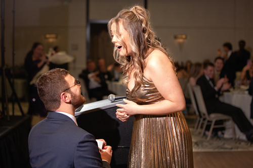 Andrew Daigneau proposes to his girlfriend at the BHP Ball.